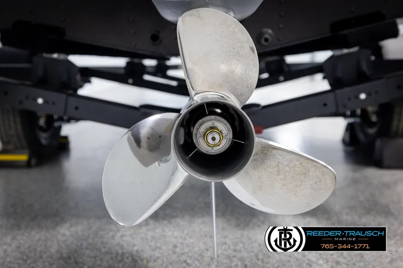 Slide: The Image of Close-up of a Lund 1975 Renegade 2025 boat propeller in a showroom. - 46