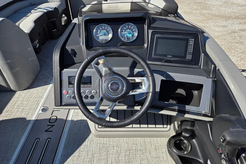 Slide: The Image of 2026 Avalon Platinum Catalina 2585 Elite boat dashboard with steering wheel and controls. - 6
