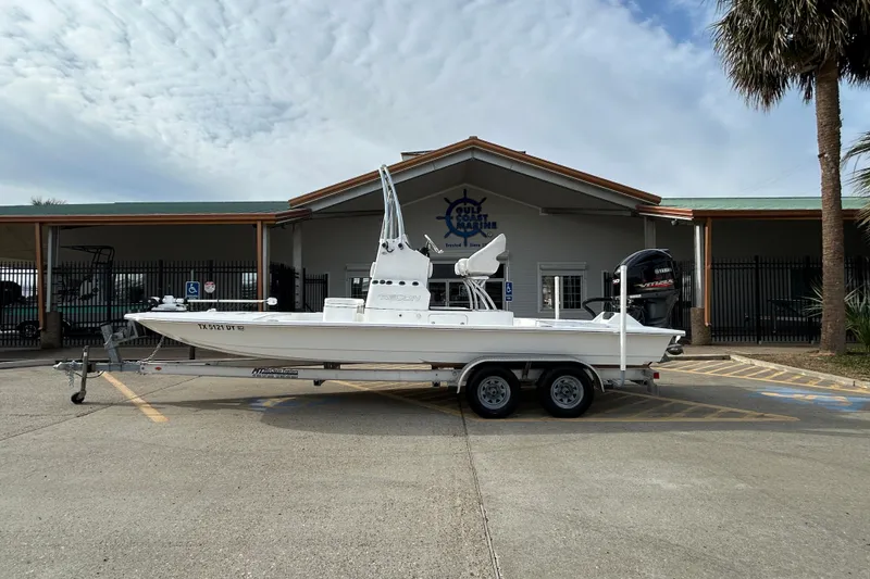 The Image of 2018 SCB Recon boat on trailer outside a maritime building. - 0