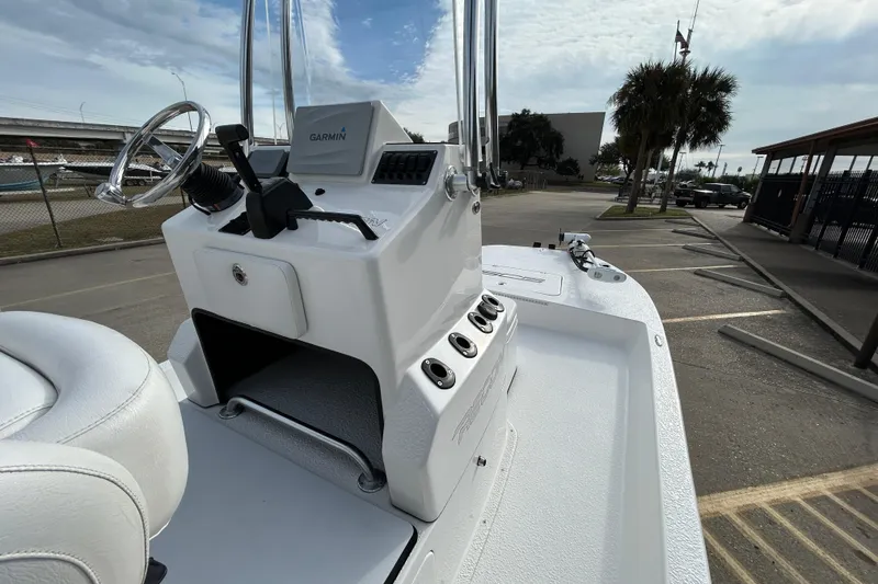 Slide: The Image of 2018 SCB Recon boat with Garmin system, parked outdoors under cloudy sky. - 10