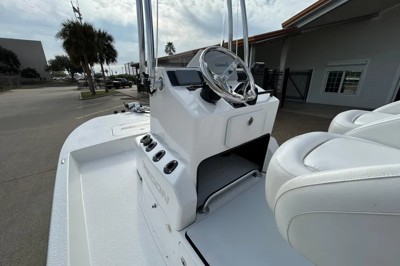 Slide: The Image of 2018 SCB Recon boat with white interior and Garmin steering system. - 11
