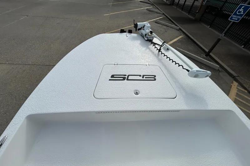 Slide: The Image of 2018 SCB Recon boat deck with trolling motor in a parking lot. - 14