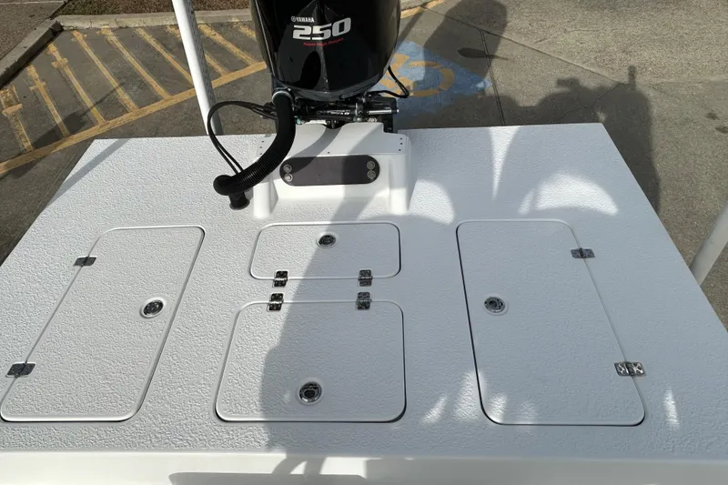 Slide: The Image of 2018 SCB Recon boat deck with Yamaha 250 engine, featuring multiple storage compartments. - 20