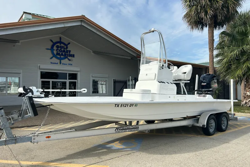 Slide: The Image of 2018 SCB Recon boat on trailer outside Gulf Coast Marine dealership. - 5