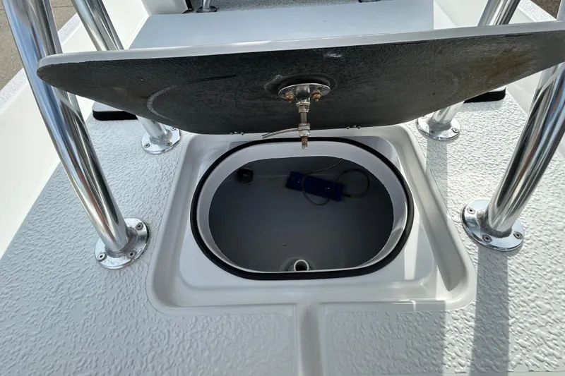 Slide: The Image of 2018 SCB Recon boat storage compartment with open lid and visible interior. - 8