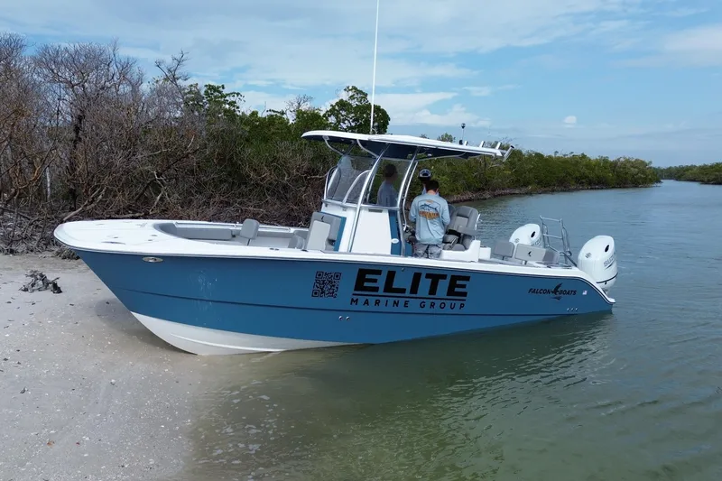 The Image of 2026 Falcon Boats 26 by Elite Marine Group on a serene waterway. - 1