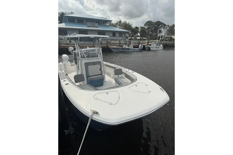 Slide: The Image of 2026 Falcon Boats 26 docked, featuring sleek design and spacious deck. - 18