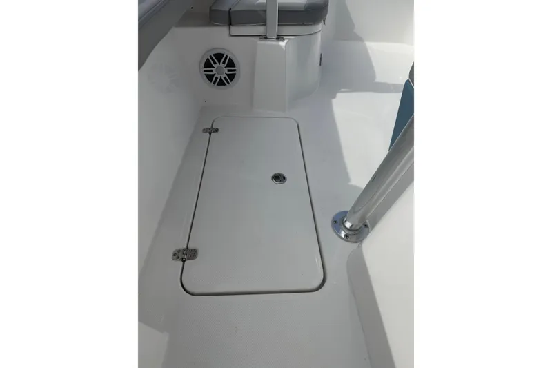 Slide: The Image of 2026 Falcon Boats 26 interior with storage hatch and speaker. - 5