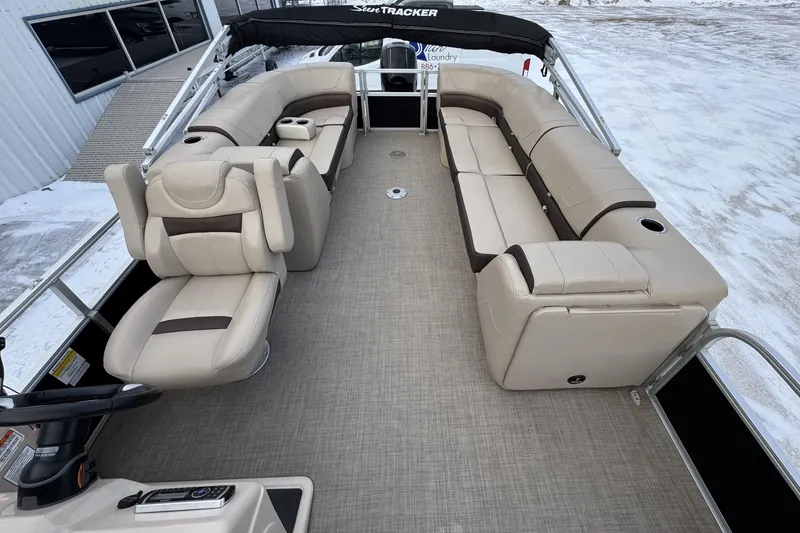 Slide: The Image of 2018 Sun Tracker Party Barge 22 XP3 interior with beige seating and helm. - 8