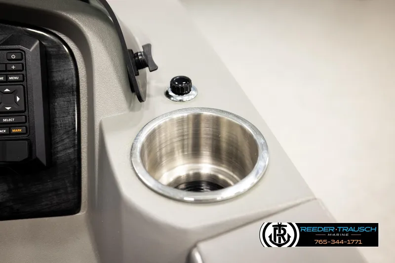 Slide: The Image of Control panel and cup holder of 2026 Avalon LSZ QLS boat by Reeder-Trausch Marine. - 44