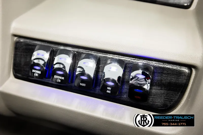 Slide: The Image of Control panel of 2026 Avalon LSZ QLS with illuminated switches for docking, lights, radio, and horn. - 45