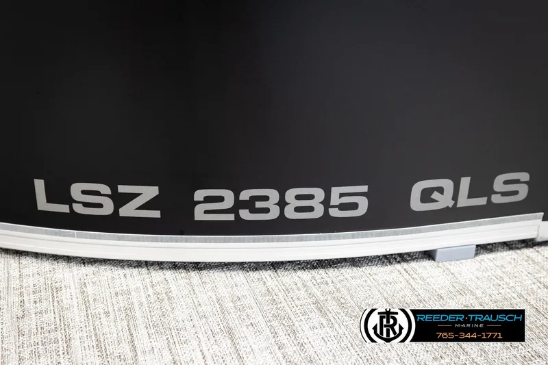 Slide: The Image of 2026 Avalon LSZ QLS boat model with Reeder-Trausch Marine branding. - 55