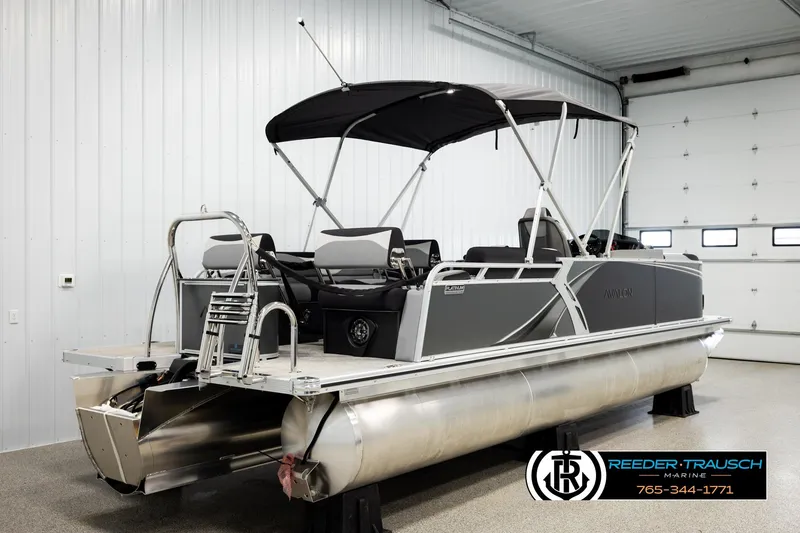 Slide: The Image of 2026 Avalon LSZ QLS pontoon boat in showroom, featuring sleek design and modern amenities. - 6