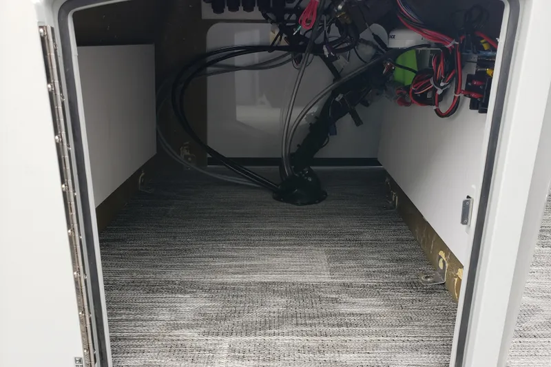 Slide: The Image of Interior view of 2026 Bentley Pontoons Bolt 223 storage compartment with wiring. - 10