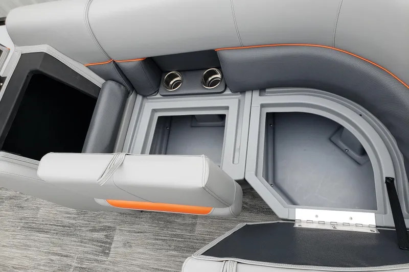 Slide: The Image of 2026 Bentley Pontoons Bolt 223 interior seating with storage compartments and cup holders. - 8