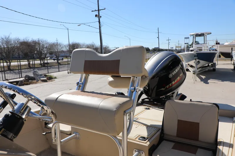 Slide: The Image of 2022 G3 Bay 20 GX boat with Yamaha outboard motor, parked outdoors. - 11