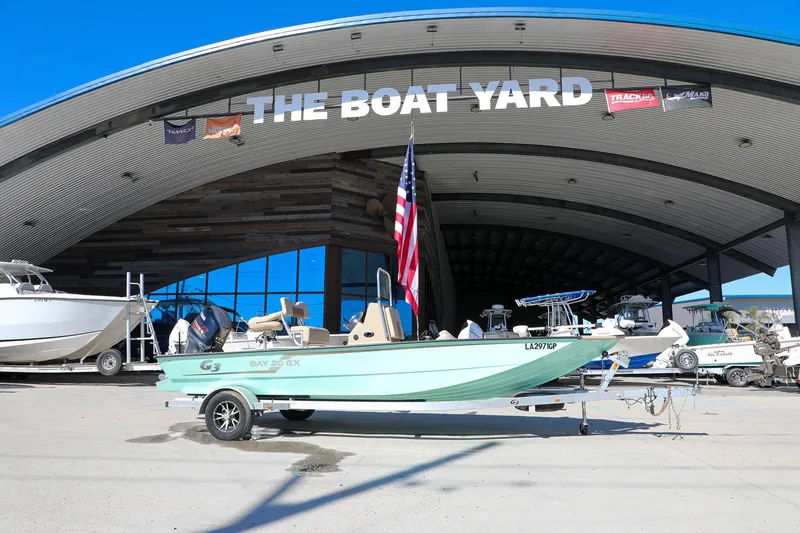 Slide: The Image of 2022 G3 Bay 20 GX boat displayed at The Boat Yard dealership. - 2