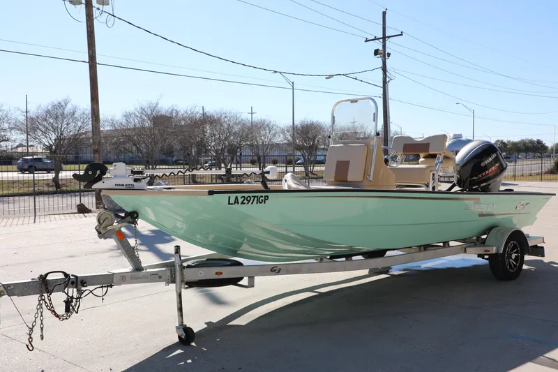 Slide: The Image of 2022 G3 Bay 20 GX boat on trailer, parked outdoors, featuring Yamaha outboard motor. - 3