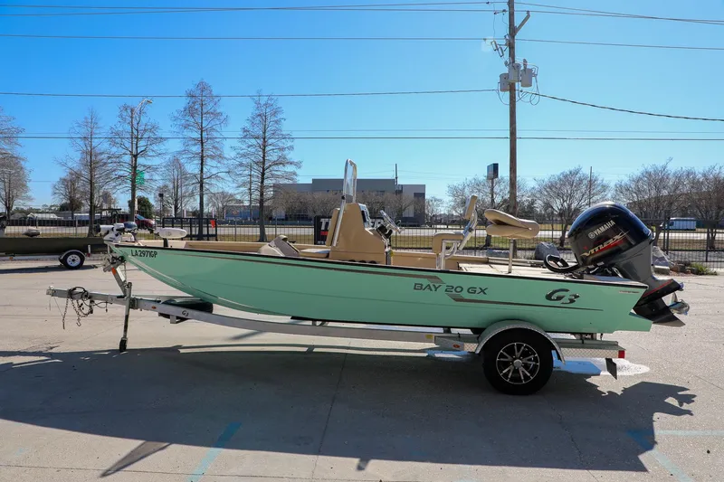 Slide: The Image of 2022 G3 Bay 20 GX boat on trailer with Yamaha outboard motor. - 6