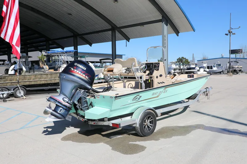 Slide: The Image of 2022 G3 Bay 20 GX boat with Yamaha outboard motor on trailer at dealership. - 7