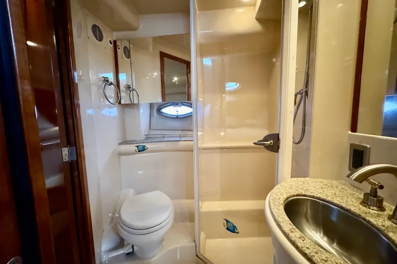 Slide: The Image of 2007 Meridian 459 Motoryacht bathroom with shower, toilet, and sink. - 15
