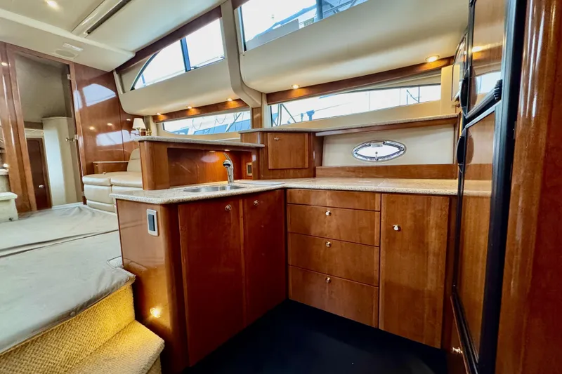 Slide: The Image of Luxurious 2007 Meridian 459 Motoryacht interior with elegant wood cabinetry and modern amenities. - 20
