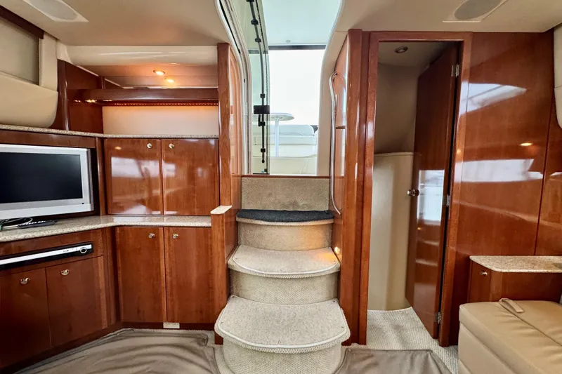 Slide: The Image of Luxurious interior of 2007 Meridian 459 Motoryacht with wooden cabinetry and carpeted stairs. - 21