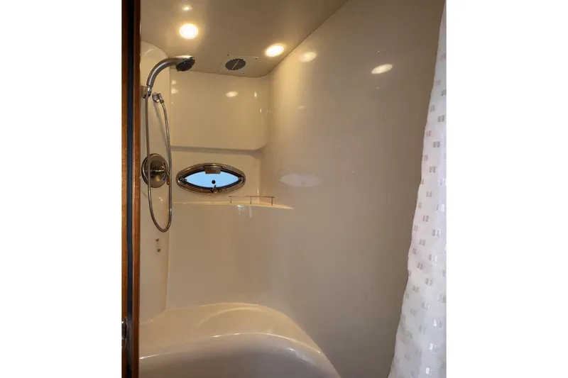 Slide: The Image of Shower area in 2007 Meridian 459 Motoryacht with porthole and modern fixtures. - 27
