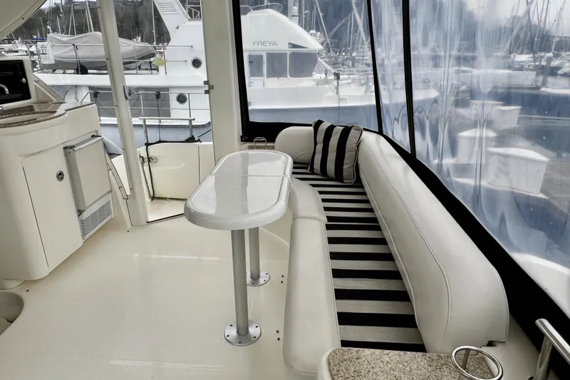 Slide: The Image of Luxurious 2007 Meridian 459 Motoryacht interior with striped seating and table. - 31