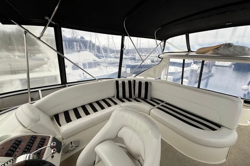 Slide: The Image of 2007 Meridian 459 Motoryacht interior with striped seating, marina view. - 37
