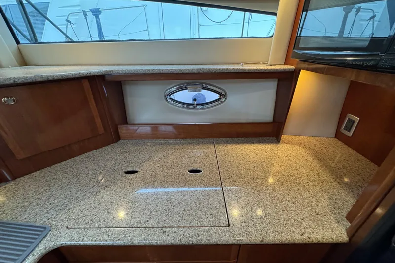 Slide: The Image of Luxurious kitchen area in a 2007 Meridian 459 Motoryacht with granite countertops. - 39
