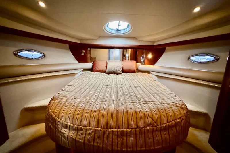 Slide: The Image of Luxurious cabin interior of 2007 Meridian 459 Motoryacht with cozy bed and ambient lighting. - 4