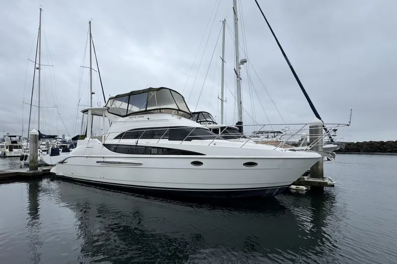 Slide: The Image of 2007 Meridian 459 Motoryacht docked in a marina on a cloudy day. - 45