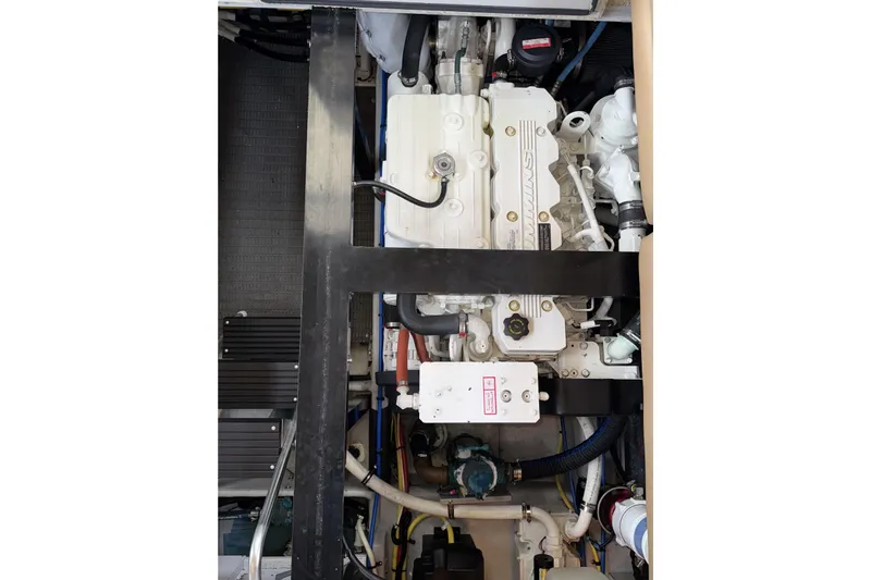 Slide: The Image of Engine compartment of a 2007 Meridian 459 Motoryacht, showcasing mechanical components. - 48