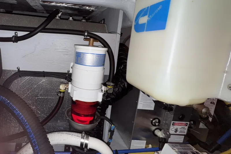 Slide: The Image of Engine room of a 2007 Meridian 459 Motoryacht showing fuel filter and hoses. - 53