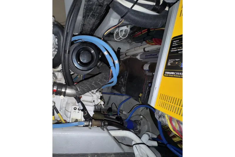 Slide: The Image of Engine room of a 2007 Meridian 459 Motoryacht with visible wiring and components. - 55