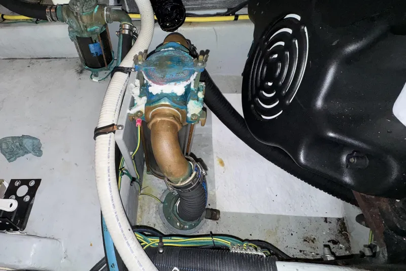 Slide: The Image of Engine room of 2007 Meridian 459 Motoryacht showing mechanical components and hoses. - 59