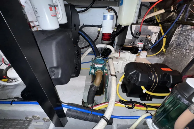 Slide: The Image of Engine room of a 2007 Meridian 459 Motoryacht with various mechanical components. - 60