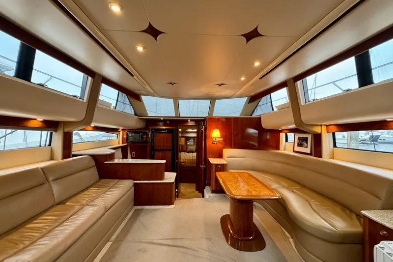 Slide: The Image of Luxurious interior of 2007 Meridian 459 Motoryacht with elegant seating and wooden accents. - 8