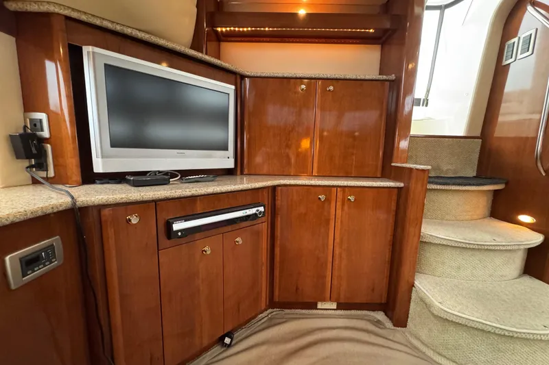 Slide: The Image of Luxurious interior of 2007 Meridian 459 Motoryacht with TV and wooden cabinetry. - 9