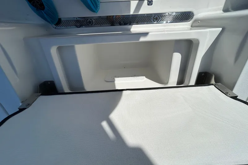 Slide: The Image of Interior storage compartment of 2026 Sea Pro 250 Bay boat, featuring sleek design. - 11
