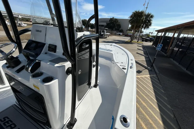 Slide: The Image of 2026 Sea Pro 250 Bay boat interior with modern controls and spacious deck. - 15