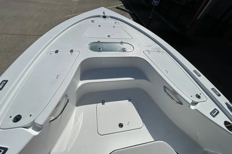 Slide: The Image of 2026 Sea Pro 250 Bay boat interior with storage compartments and seating area. - 20