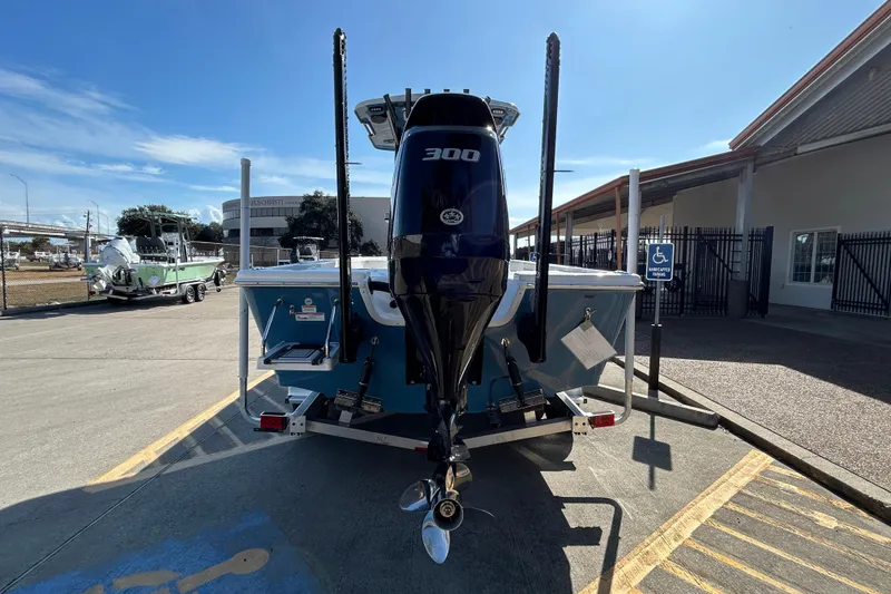 Slide: The Image of 2026 Sea Pro 250 Bay boat with 300 horsepower engine, parked outdoors. - 6