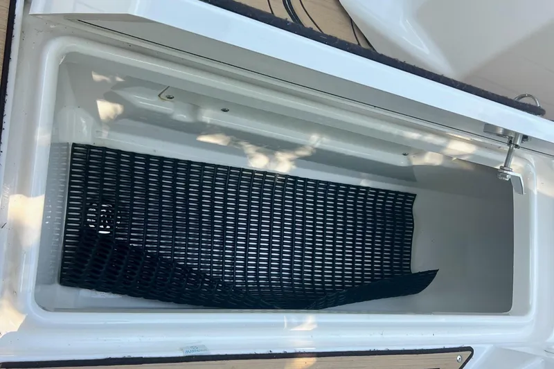 Slide: The Image of Yamaha Boats 275SD 2021 storage compartment with black mat. - 15