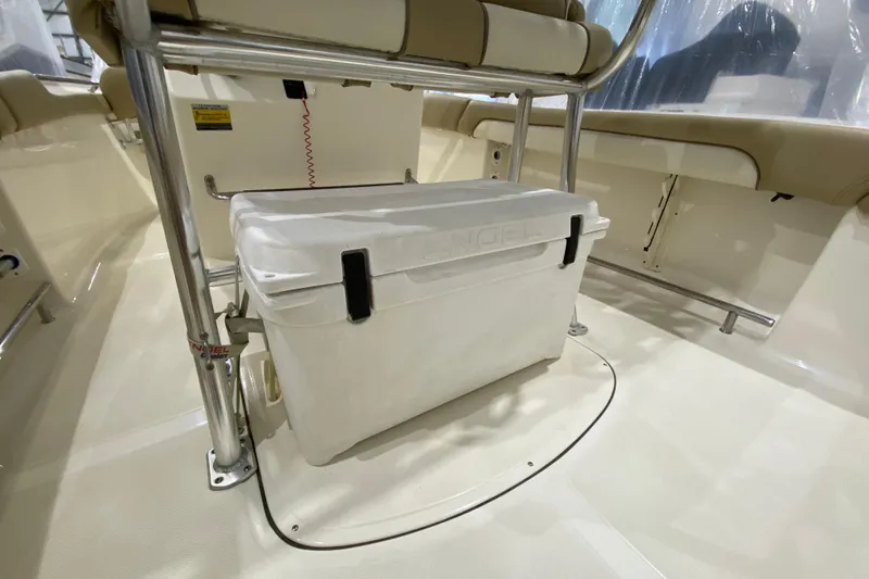 Slide: The Image of 2019 Pioneer 202 Islander boat interior with white cooler under seat. - 10