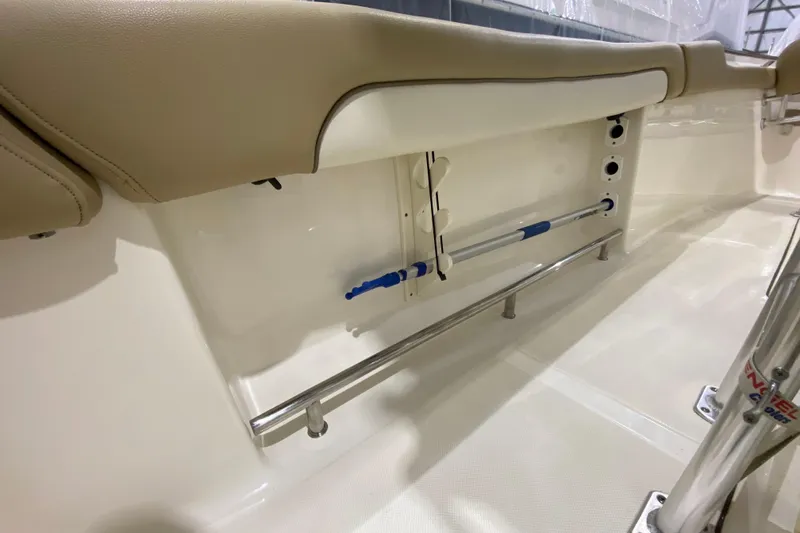 Slide: The Image of 2019 Pioneer 202 Islander boat interior with beige seating and stainless steel railings. - 13