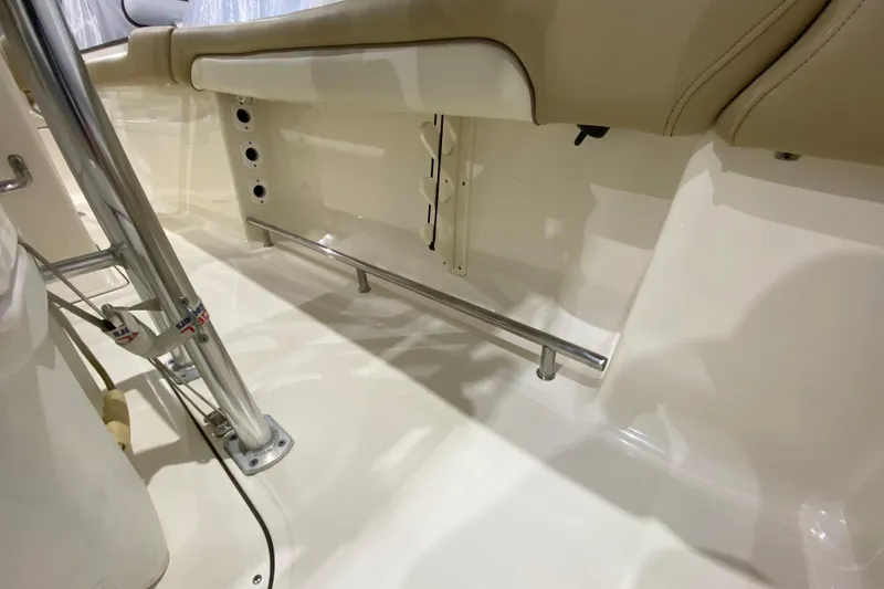 Slide: The Image of 2019 Pioneer 202 Islander boat interior with stainless steel fittings and beige seating. - 14