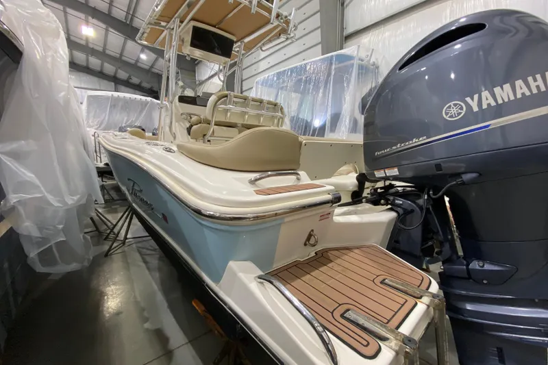 Slide: The Image of 2019 Pioneer 202 Islander boat with Yamaha engine in storage facility. - 2