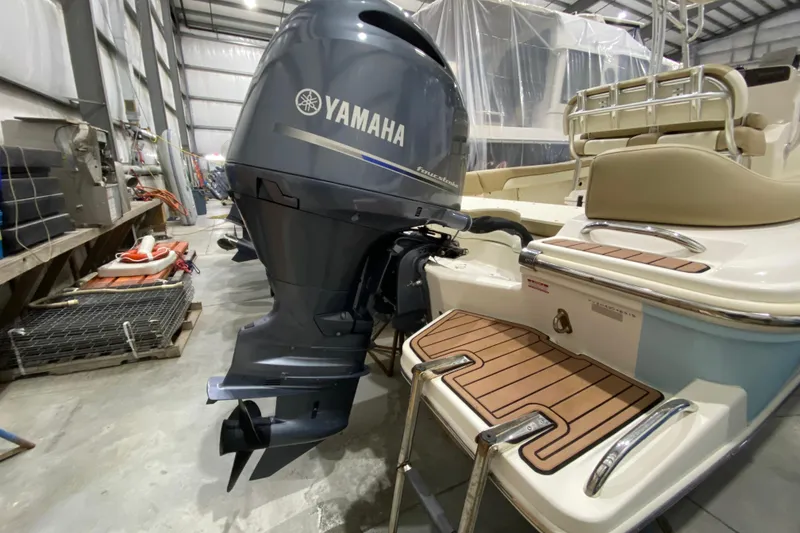 Slide: The Image of 2019 Pioneer 202 Islander boat with Yamaha outboard motor in storage facility. - 4